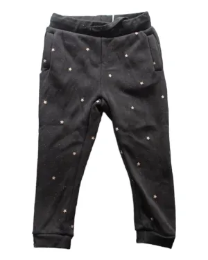 Black track pants with white spots