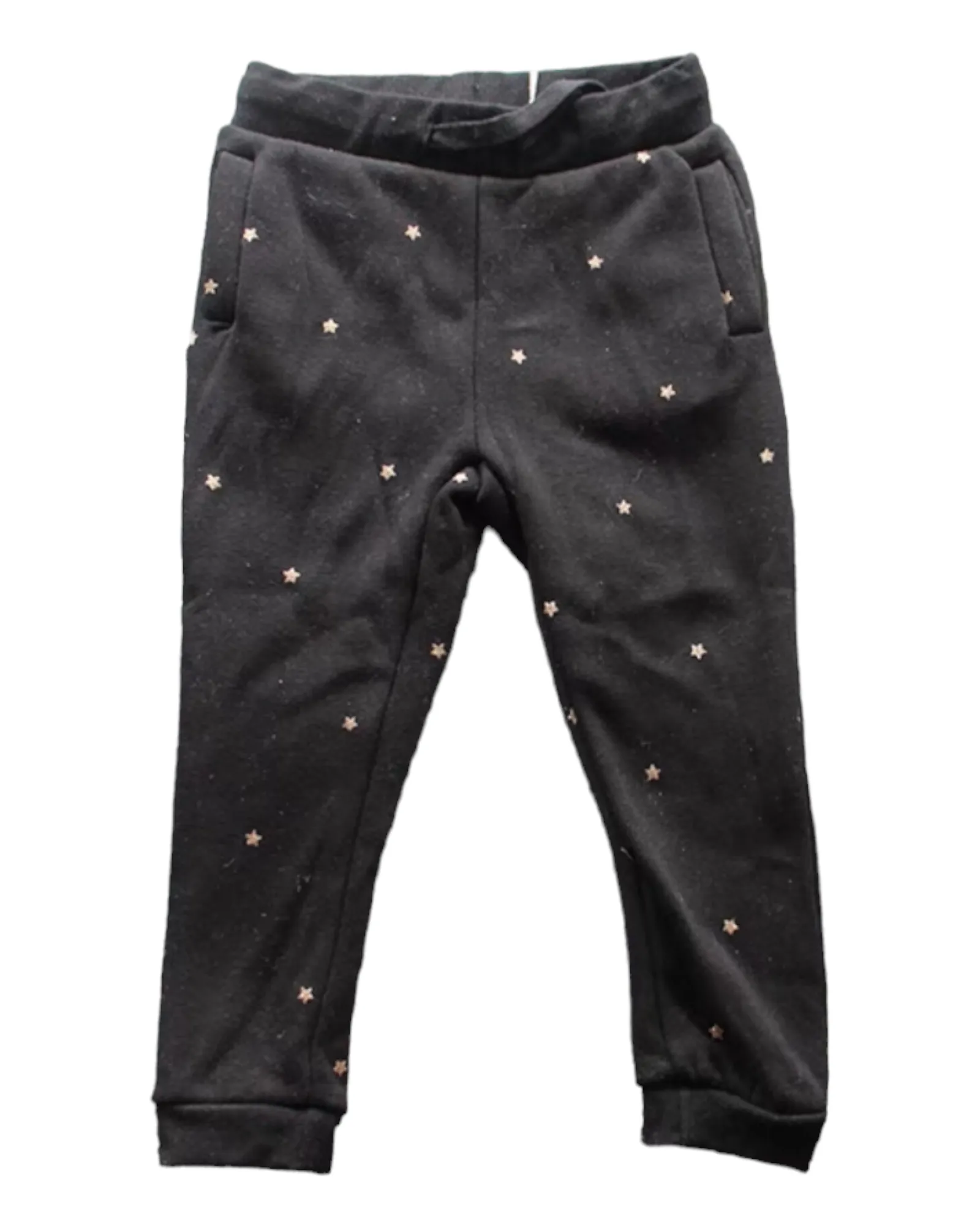 Black track pants with white spots